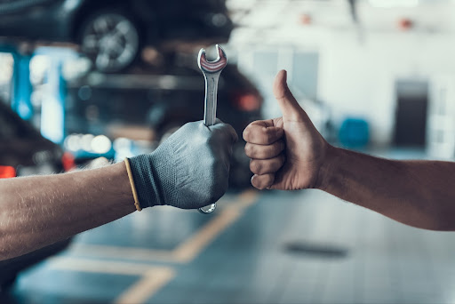 Thumbs up with wrench